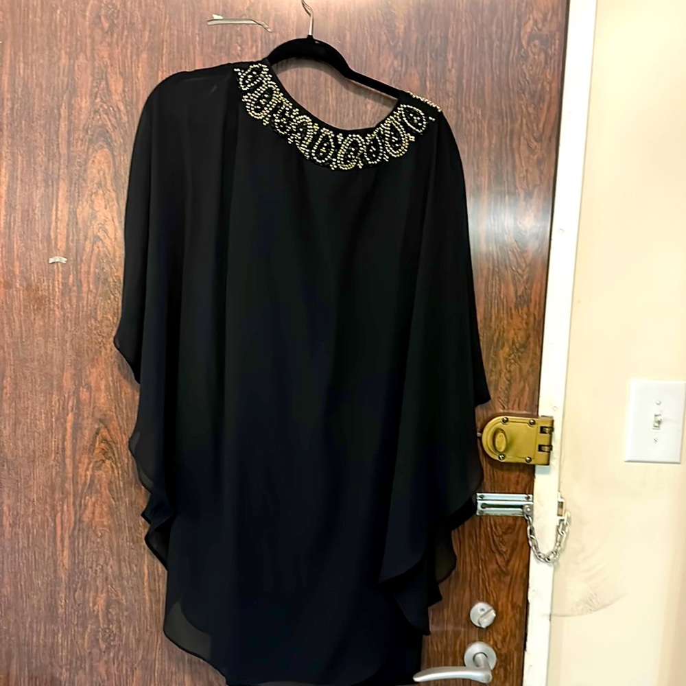 Black dress with beads around neck